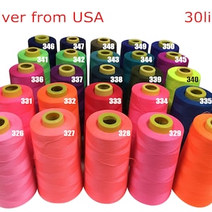 May include: Thirty spools of thread in various colors, including pink, orange, green, blue, and purple. The spools are arranged in a semi-circle, with the numbers 326 through 350 printed on each spool.