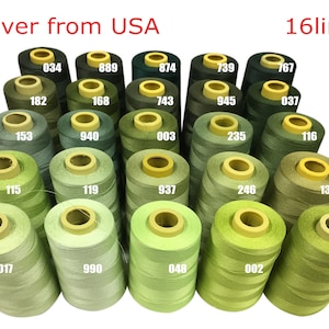 May include: A collection of 16 spools of green thread, ranging in shades from dark green to light green. Each spool has a white label with a number printed on it. The text "Deliver from USA" and "16lines" is printed above the spools.