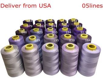 May include: A collection of 20 spools of thread in various shades of purple, blue, and gray. The spools are arranged in a triangular shape. The numbers 824, 979, 646, 630, 626, 627, 193, 262, 634, 805, 920, 629, 195, 038, 164, 187, 217, 293, 823, 917, 015, 013, 628 are printed on the spools.
