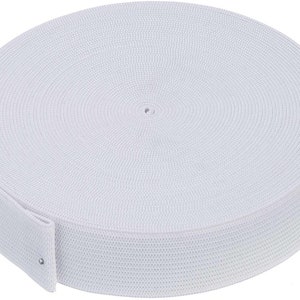 May include: A white elastic band, rolled up in a circle, with a small white tag attached.