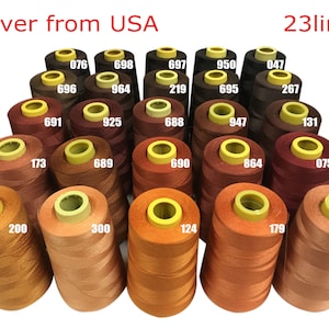 May include: A collection of 23 spools of thread in various shades of brown, orange, and red. The spools are arranged in a pyramid shape and labeled with numbers.