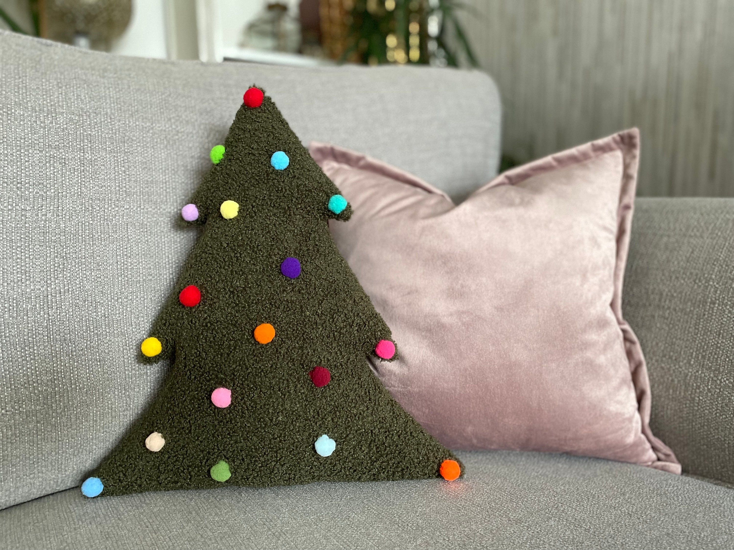 Christmas Tree Pillow Tutorial - Arrange the pom poms on the pillow front  to your liking - WeAllSew