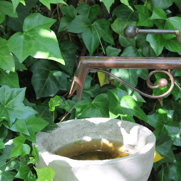 Fountain spout with brass valve.