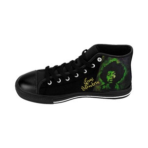 May include: Black high-top canvas shoes with a green and black graphic of Jimi Hendrix on the side. The text "Jimi Hendrix" is written in gold lettering on the side of the shoe.