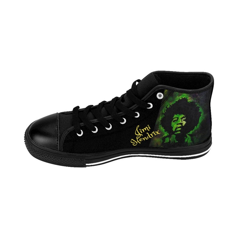 May include: Black high-top canvas shoes with a green and black graphic of Jimi Hendrix on the side. The text "Jimi Hendrix" is written in gold lettering on the side of the shoe.