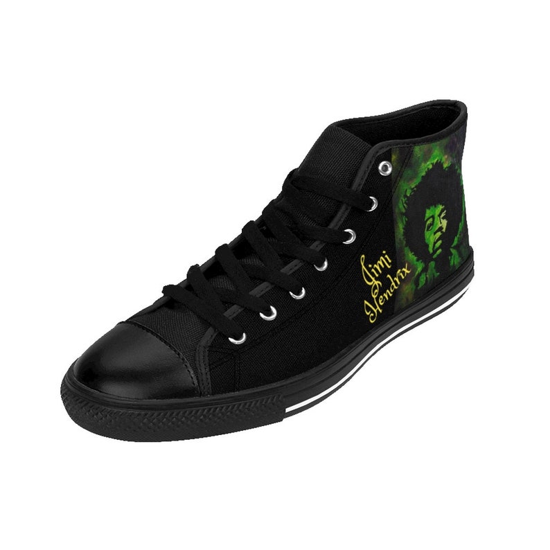 May include: Black high-top canvas shoes with a green and black watercolor design featuring Jimi Hendrix's portrait and the text "Jimi Hendrix" in gold lettering.