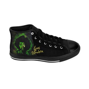 May include: Black high-top canvas sneakers with a green and black image of Jimi Hendrix and the text "Jimi Hendrix" in gold lettering.