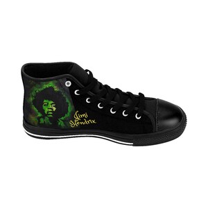 May include: Black high-top canvas shoes with a green and black image of Jimi Hendrix on the side. The shoes have white laces and a white stripe around the sole.