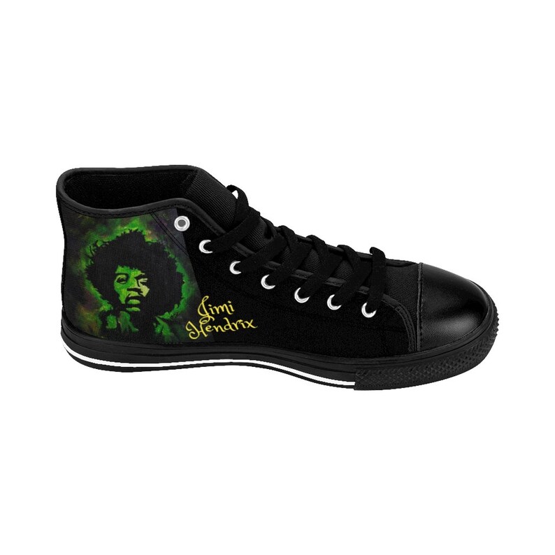May include: Black high-top canvas shoes with a green and black image of Jimi Hendrix on the side. The shoes have white laces and a white stripe around the sole.