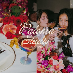 Lifestyle scene with two women drinking cocktails at a floral-decorated table, overlaid with the white Paloma Studio logo.