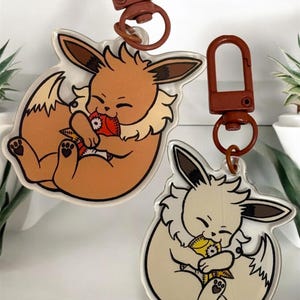 Chomp’n Eevees, double sided acrylic keychains 2.5” (shinys on back side!)
