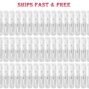 May include: A collection of small, clear plastic spray bottles with white spray nozzles. The bottles are arranged in neat rows and columns, creating a grid-like pattern. The text "SHIPS FAST & FREE" is visible at the top.