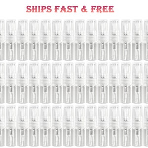 May include: A collection of small, clear glass spray bottles with white spray tops. The bottles are arranged in neat rows, and the image includes the text "SHIPS FAST & FREE" in a pink and brown font.