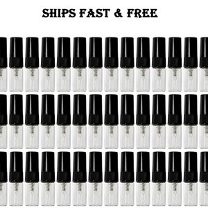 May include: Rows of small, clear glass perfume sample vials with black caps. The vials are arranged in a grid pattern, and the text "SHIPS FAST & FREE" is at the top of the image.