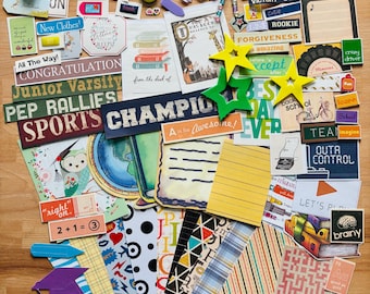May include: A collection of assorted paper stickers and die-cut ephemera featuring various themes including sports, school, animals, and motivational phrases like Champion, Forgiveness, and A is for Awesome, alongside geometric and striped patterns.