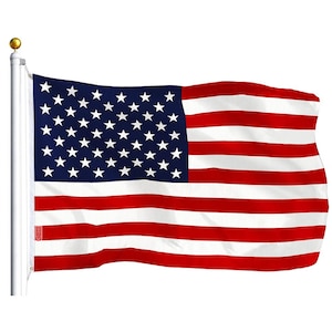 May include: A red, white, and blue American flag waving in the wind. The flag has 13 horizontal stripes and 50 white stars on a blue field.