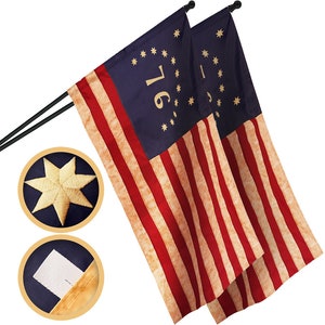 May include: Two American flags with 13 red and white stripes and a blue canton with 13 white stars. The canton of each flag has the number "1776" in gold lettering.