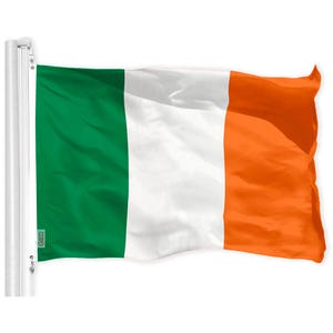 May include: A green, white, and orange flag waving in the wind. The flag is attached to a white pole.