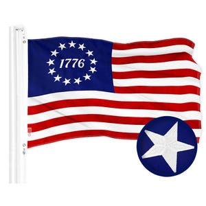 May include: A flag with a blue canton featuring 13 white stars encircling the year 1776. The flag has alternating red and white stripes. A circular patch with a white star on a blue background is also visible.
