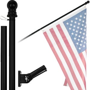 May include: A black metal flagpole with a black finial and a black wall mount bracket. The flagpole is holding an American flag.