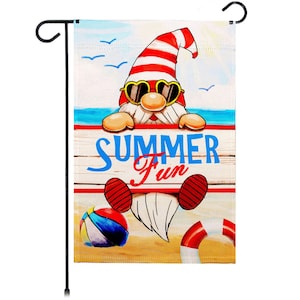 May include: A garden flag with a cartoon gnome wearing sunglasses and a red and white striped hat. The gnome is holding a sign that says "Summer Fun". The flag is set against a beach scene with a blue ocean, yellow sand, and a beach ball.