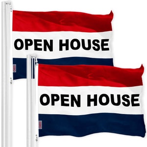 May include: Two red, white, and blue flags with the text "OPEN HOUSE" in black letters. The flags are waving in the wind.
