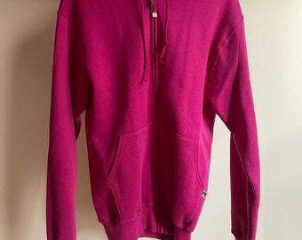 Vintage deadstock new with tags 1990’s magenta pink Russell Athletic zip up hoodie. Made in the USA. Size medium. 50/50 cotton poly blend