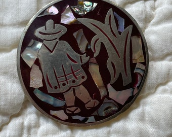 Vintage sterling zilver en abalone schelp alpaca pin gemaakt in Mexico. 2” diameter.