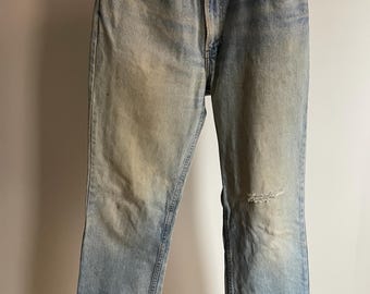 Vintage distressed Levi’s orange tab 509 denim jeans. Paper tag. Made in the USA. 34w x 32L. 8” leg opening. 12” rise.