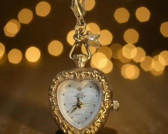 Vintage KIRKS FOLLY - gouden hartvormig quartz-sleutelhangerhorloge met ster