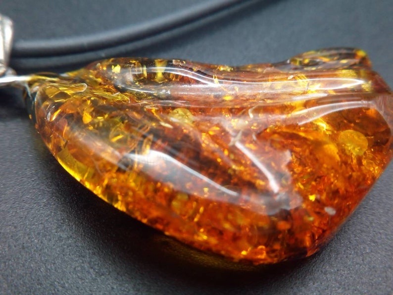 The natural Baltic Amber pendant 35x30 mm Unregular shape 1.37x1.18 inches