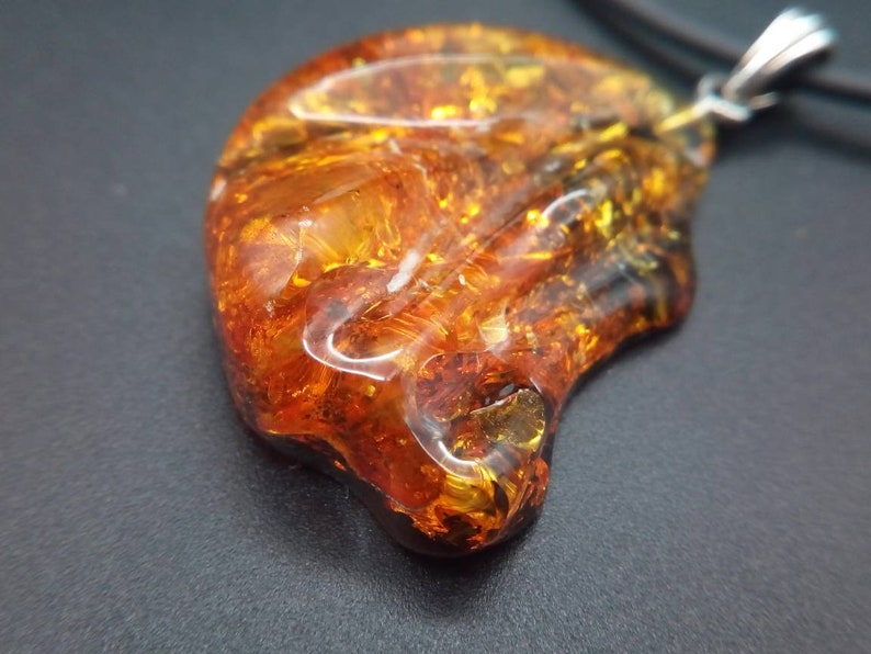The natural Baltic Amber pendant 35x30 mm Unregular shape 1.37x1.18 inches