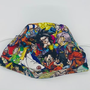 May include: A colourful face mask featuring a variety of characters from the popular anime series Dragon Ball Z. The mask is made of a soft, breathable fabric and is perfect for everyday use.