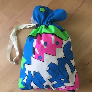 multi coloured printed washbag