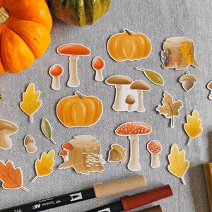 Feuilles d'automne et champignons en flocons d'autocollants pour un journal quadrillé ou un agenda à puces