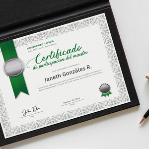 May include: A white certificate with a green ribbon and seal, framed in black. The certificate reads "Certificado de participaci&oacute;n del maestro" and is awarded to "Janeth Gonz&aacute;les R." The date is August 30, 2019.