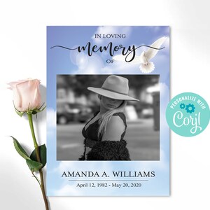May include: A memorial card featuring a black and white photograph of a person in a hat, set against a sky backdrop. The text reads "In Loving Memory of Amanda A. Williams, April 12, 1982 - May 20, 2020." A pink rose is on the left.