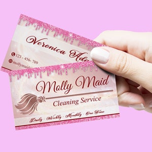 May include: Pink and white business card with a pink glitter border. The text on the card reads "Molly Maid Cleaning Service" and "Daily - Weekly - Monthly - One Time".