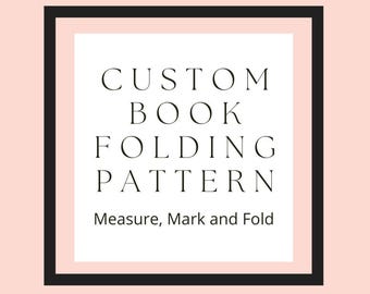 May include: Black and white text on a pink background within a black frame. The text reads "CUSTOM BOOK FOLDING PATTERN Measure, Mark and Fold".