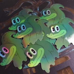 Sticker holographique King Gizzard and the Lizard Wizard Gizzy Gator KGLW 2,5"