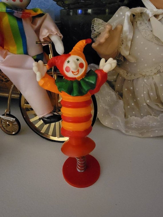 Pop up sales clown toy