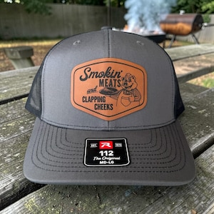 May include: A set of three ceramic mugs with a speckled, matte finish. The mugs are in shades of cream, light gray, and dark gray. Each mug has a simple, minimalist design, perfect for coffee or tea.