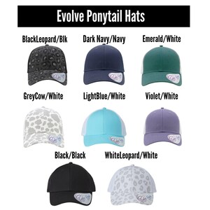 May include: An assortment of "Evolve Ponytail Hats" in various colors and patterns. Styles include a black leopard print, dark navy, emerald green, light blue, violet, black, and white leopard print. Each hat has a curved brim and a ponytail opening.