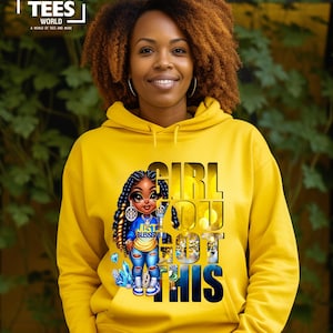 May include: Yellow hoodie with a graphic of a cartoon girl with braids and the text "Girl You Got This".