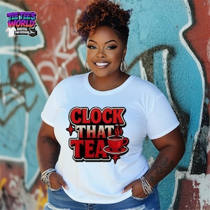May include: White t-shirt with the text "CLOCK THAT TEA" in red and black, featuring a red teacup graphic. The shirt is worn by a person with curly brown hair and is set against a graffiti background.