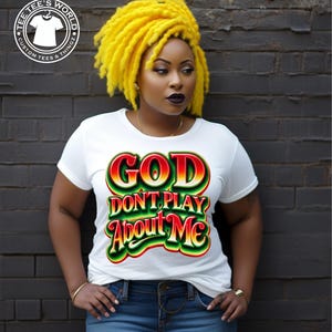 May include: White t-shirt with a colorful graphic that says "GOD DON'T PLAY About ME".