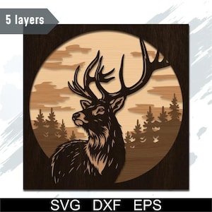 May include: A wooden wall art piece depicting a stag with prominent antlers, set against a forest and a circular sky. The artwork is multi-layered with a dark brown frame and a light brown interior. The text "5 layers" is visible. The image also includes the text "SVG DXF EPS".