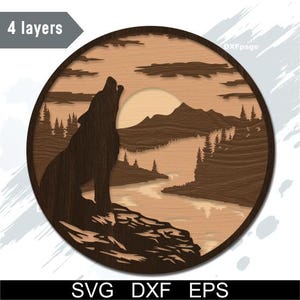 May include: A layered wooden art piece depicting a howling wolf in a natural landscape. The design features a wolf silhouette, mountains, trees, and a river, all within a circular frame. The piece is made of multiple layers of wood, creating a 3D effect. The text "4 layers" is visible.
