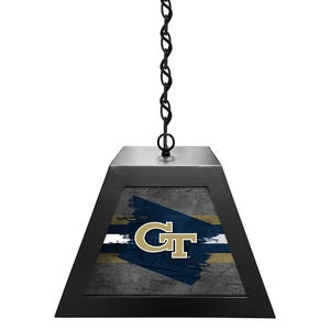 May include: Black pendant light with a chain and a square shade featuring a distressed gray and blue background with a white stripe and the Georgia Tech logo in gold.