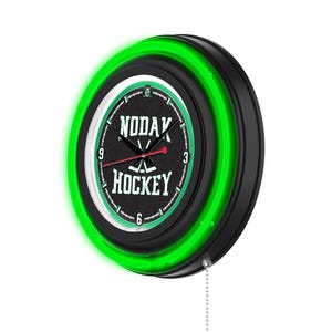 May include: A black and green neon clock with a white face and black hands. The clock face has the text "NODAK HOCKEY" and a hockey stick graphic. The clock has a green neon ring around the edge.